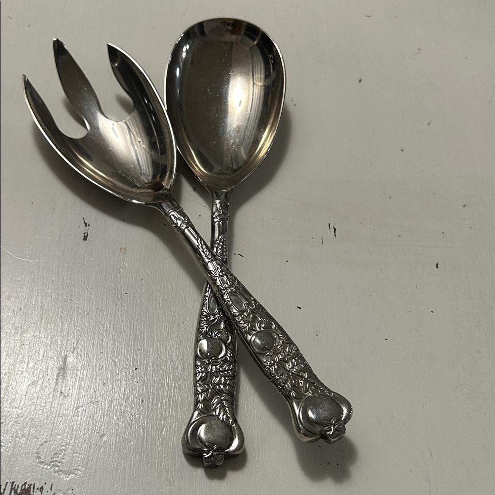 Ornate silver plated salad server set, spoon and fork.